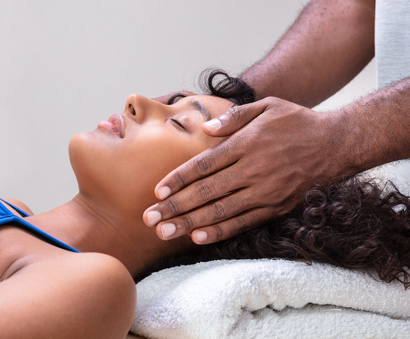 person laying down, taking part in energy healing