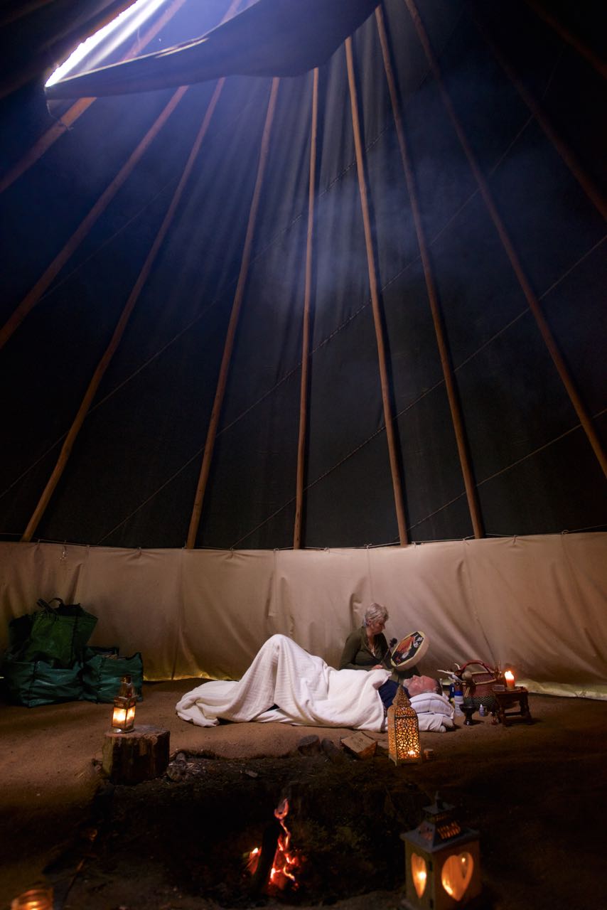 person laying down, taking part in energy healing