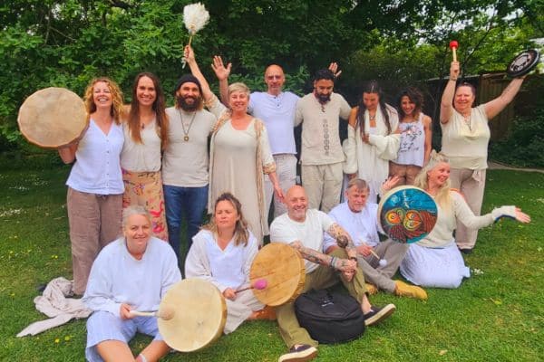 2 person laying down, taking part in energy healing