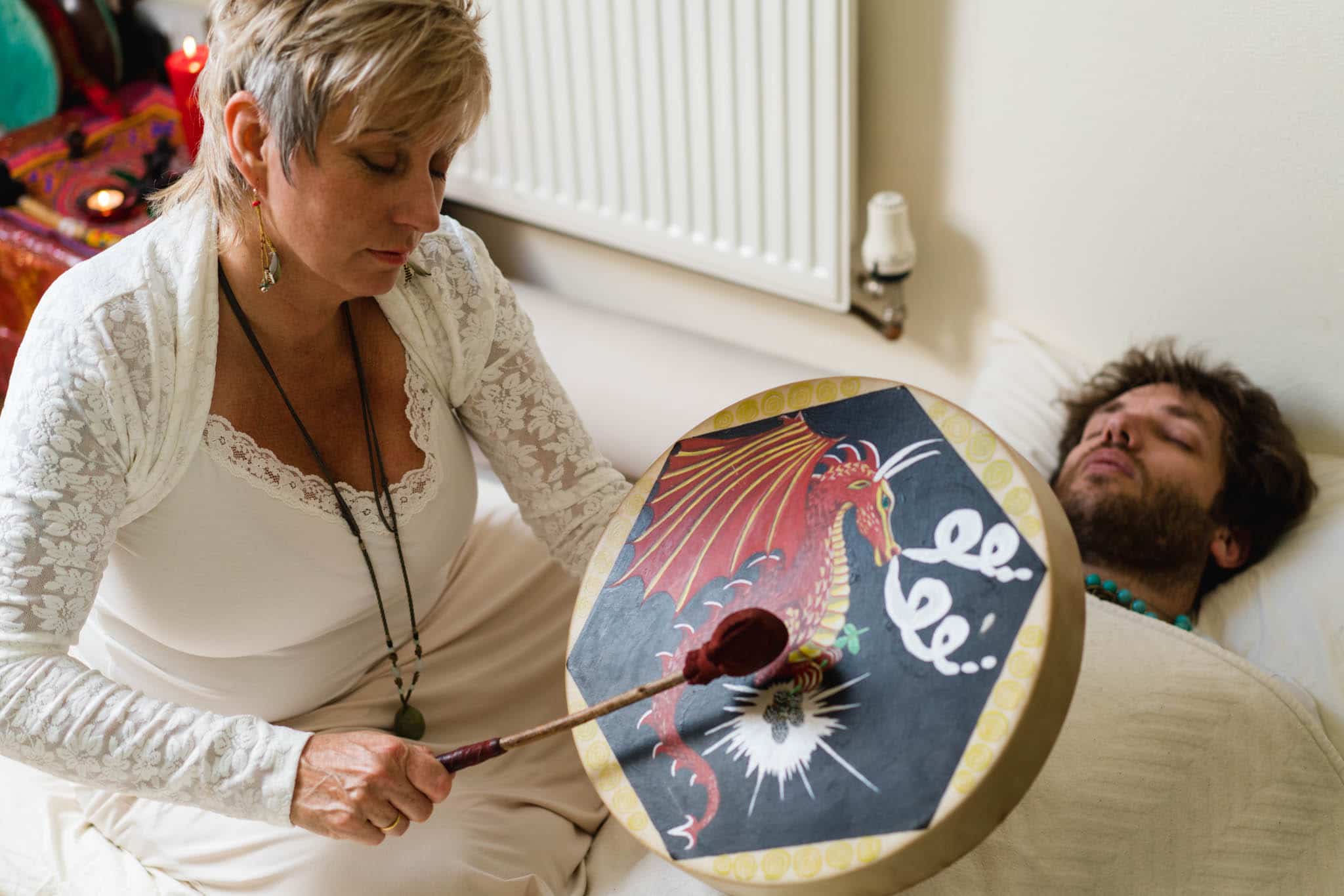 me mid healing with Fab Sue Holmes completing a healing session with someone lay down next to her