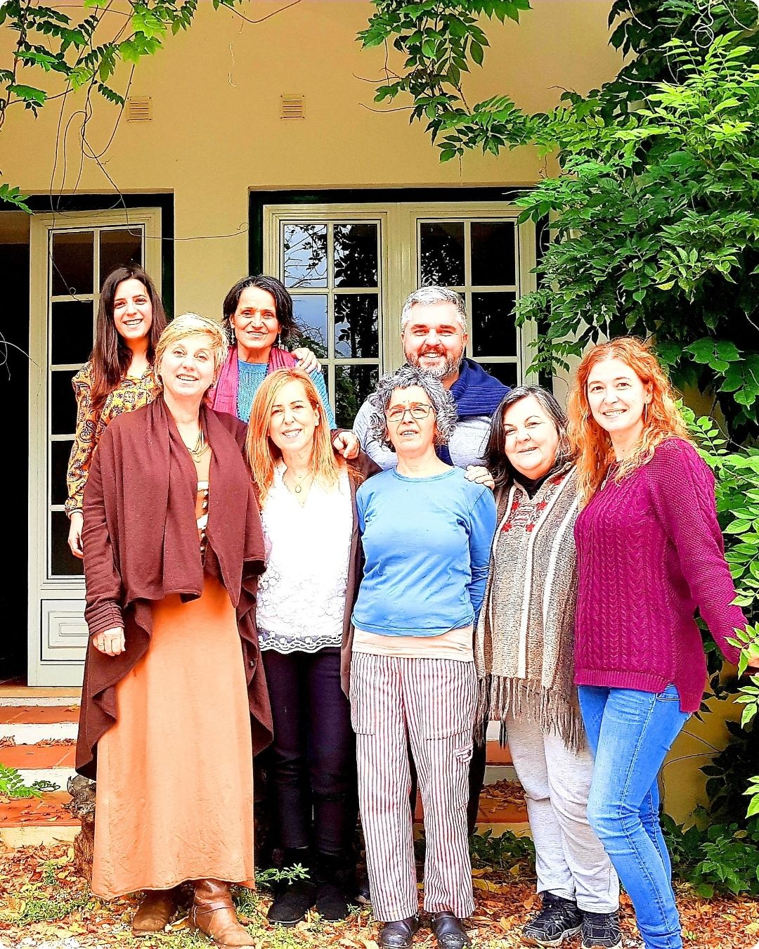 group of people sat down attending a space clearing and geomancy course 